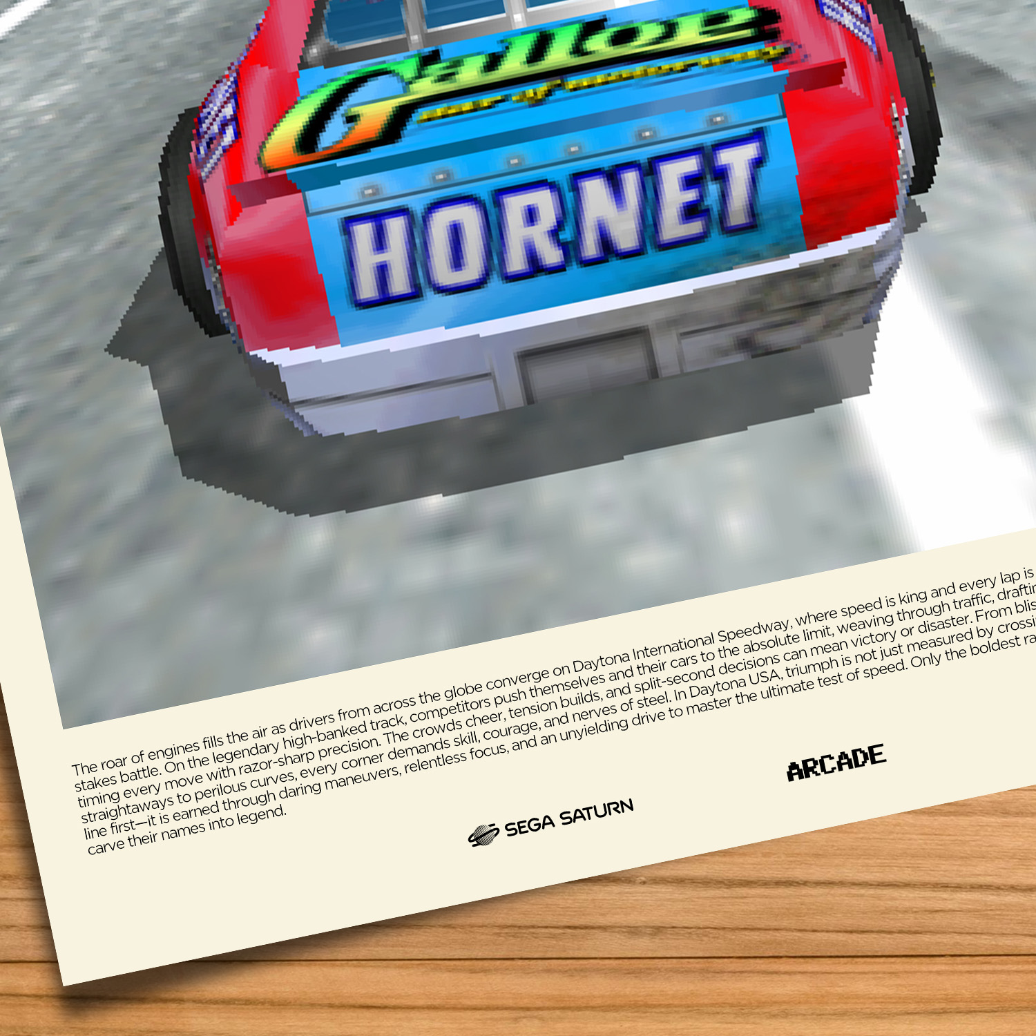 Gallery-style Daytona USA poster on a wood table background
