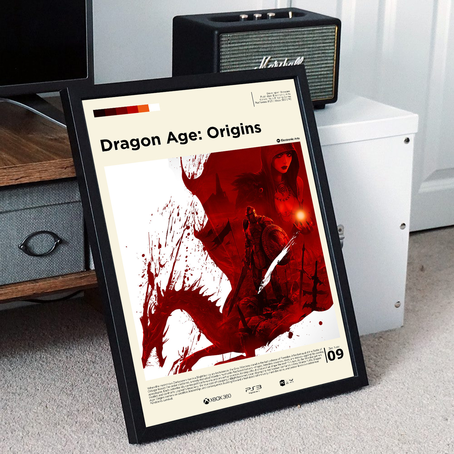 Minimalist, gallery-style Dragon Age poster in a black frame leaning against a unit