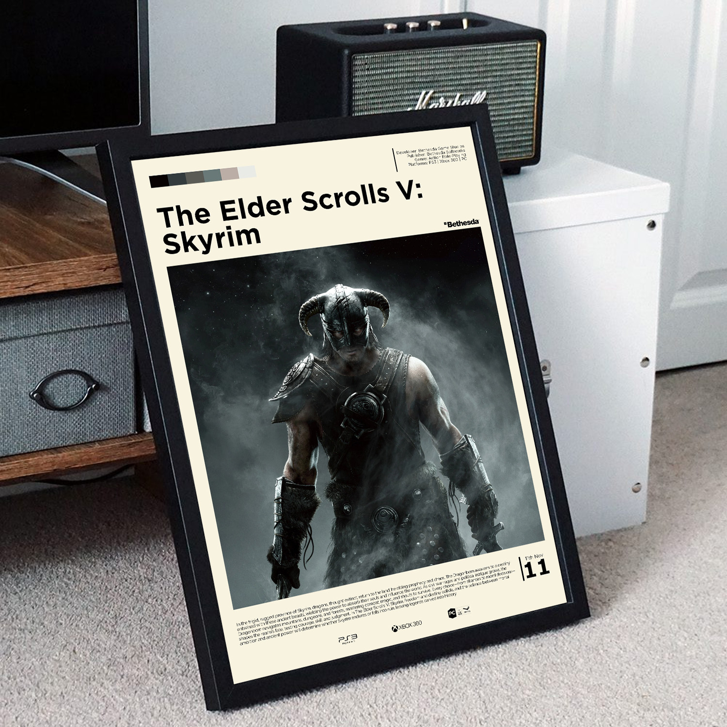Minimalist, gallery-style Elder Scrolls Skyrim Dragonborn poster in a black frame leaning against a unit