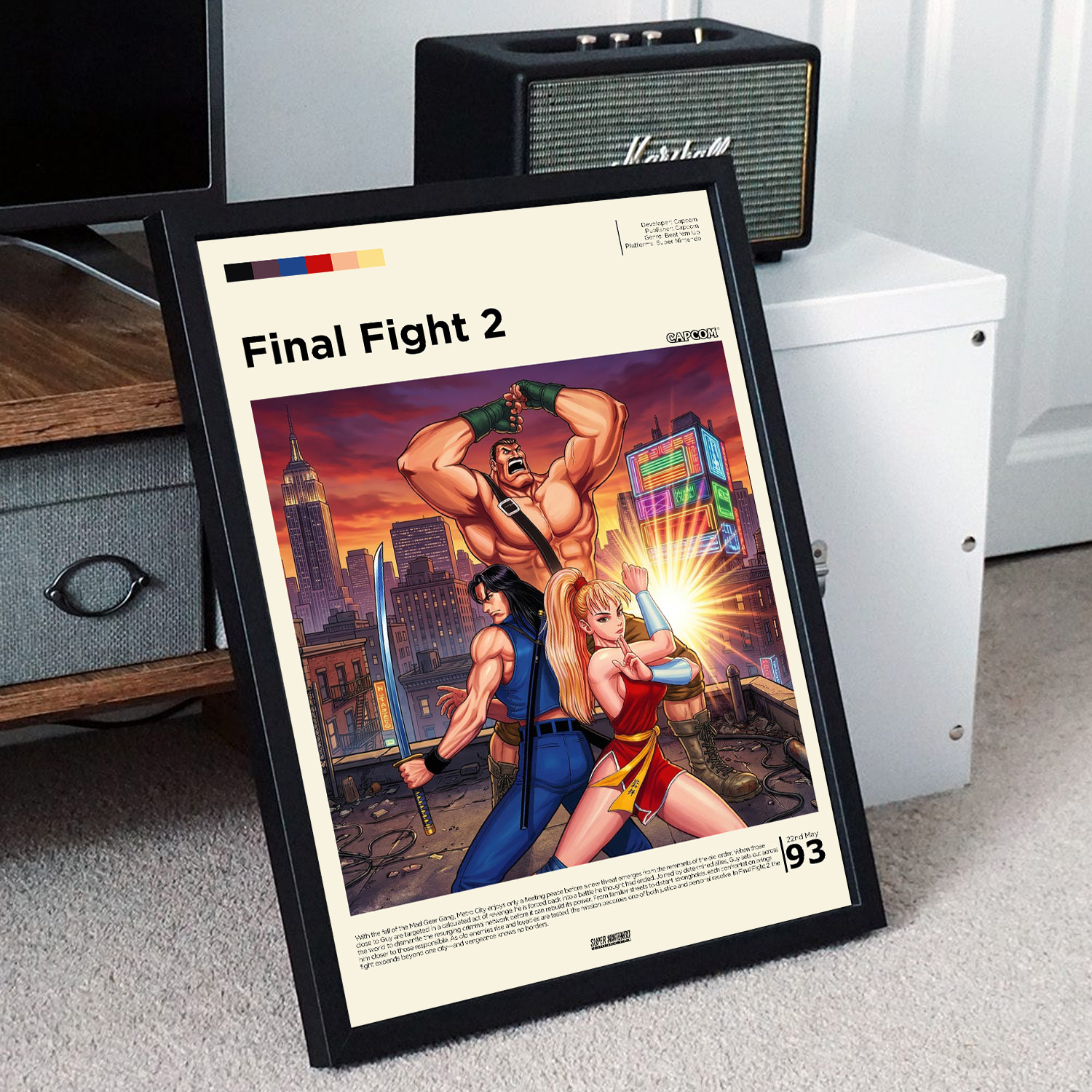 Minimalist, gallery-style Final Fight 2 poster in a black frame leaning against a unit